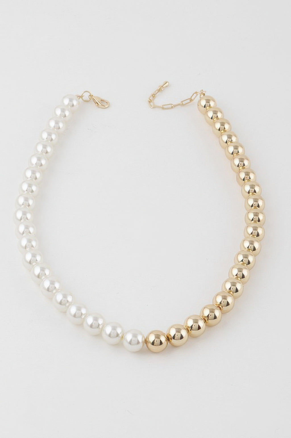 Two-toned beaded necklace with cream bead strand and gold bead strand clasp