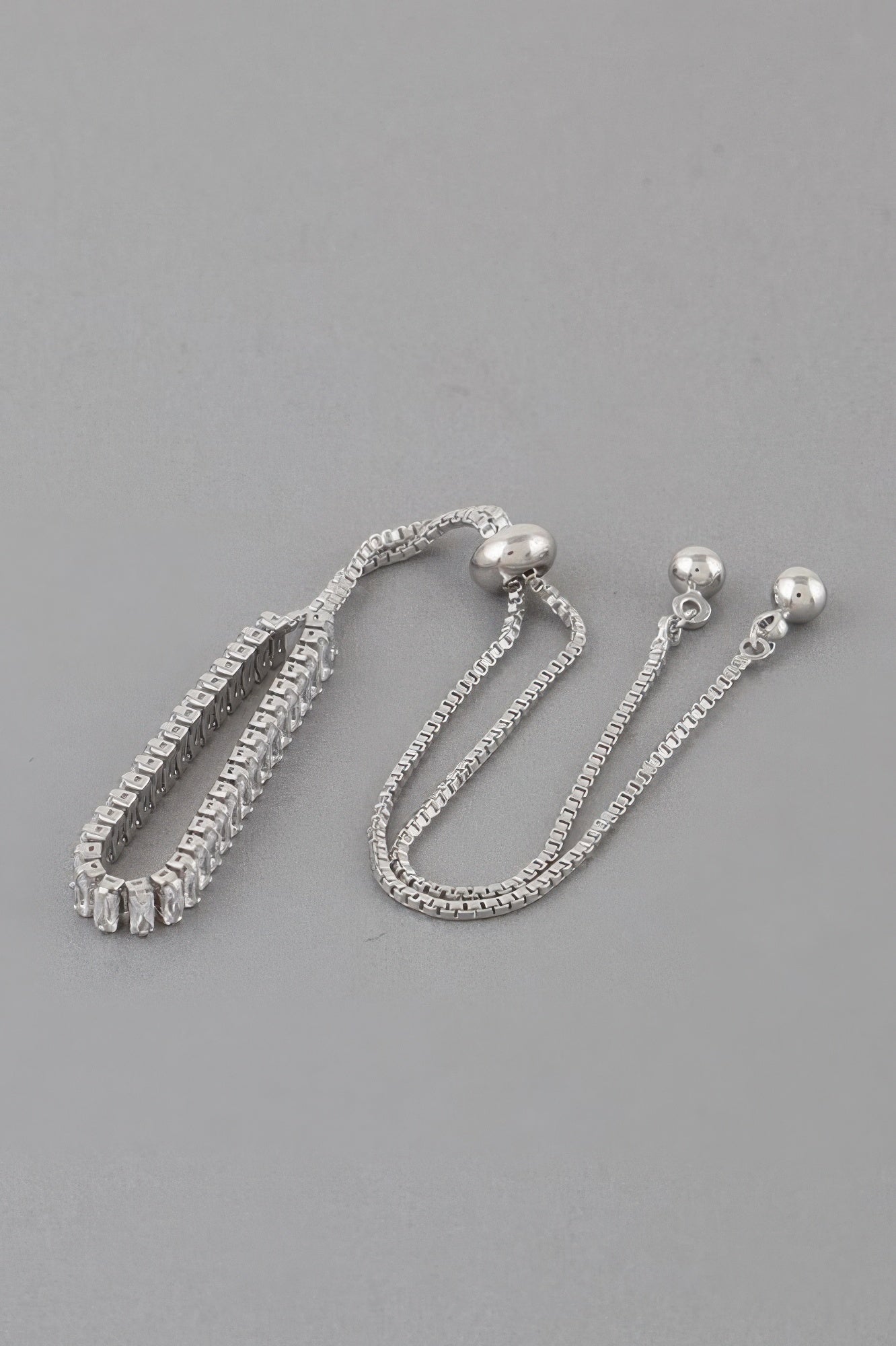 Classic rhinestone adjustable bracelet in silver with clear stones and round bead closures