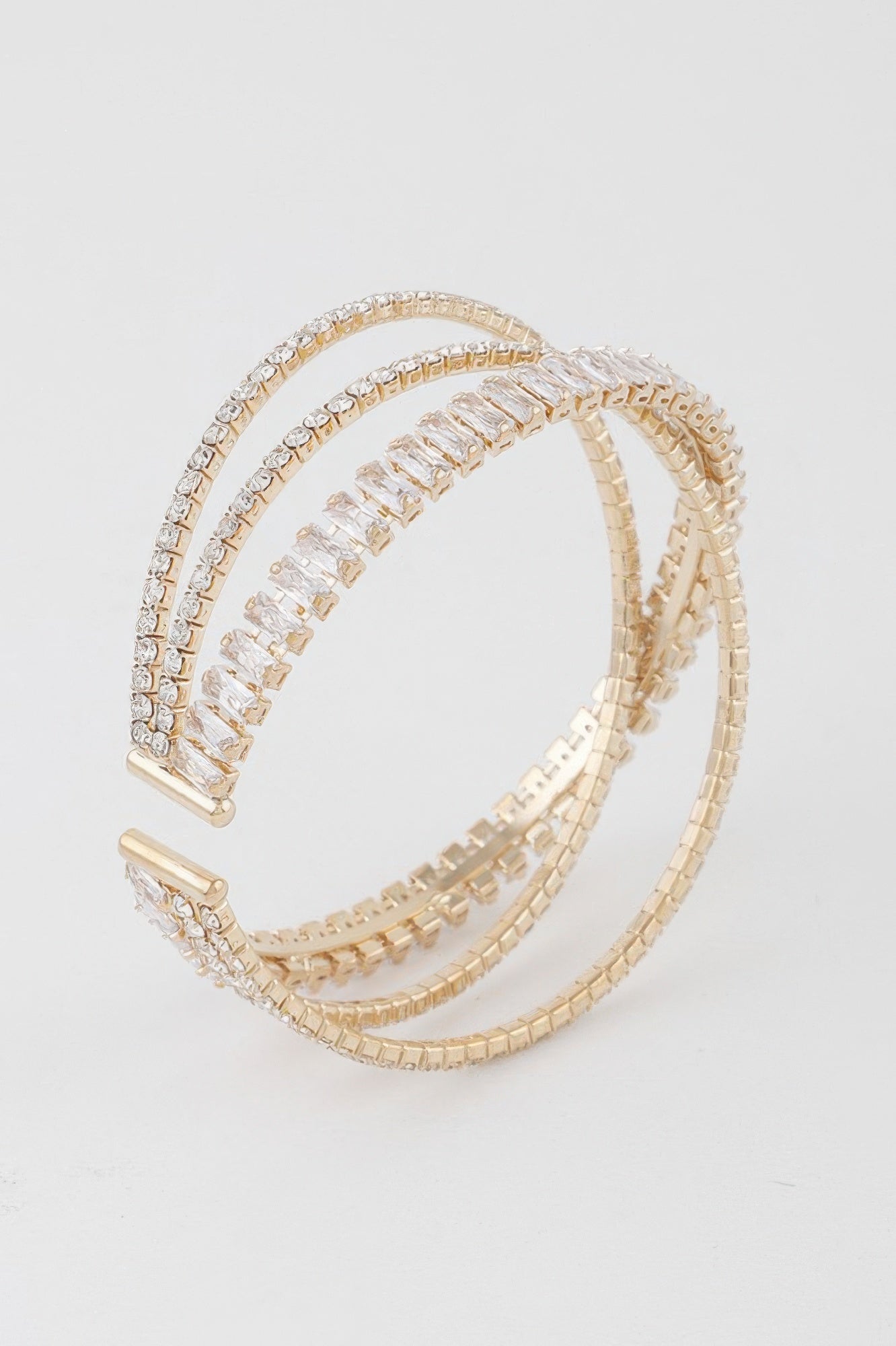 Triple crystal laced cuff bracelet, gold-tone with clear stones in a curved double band