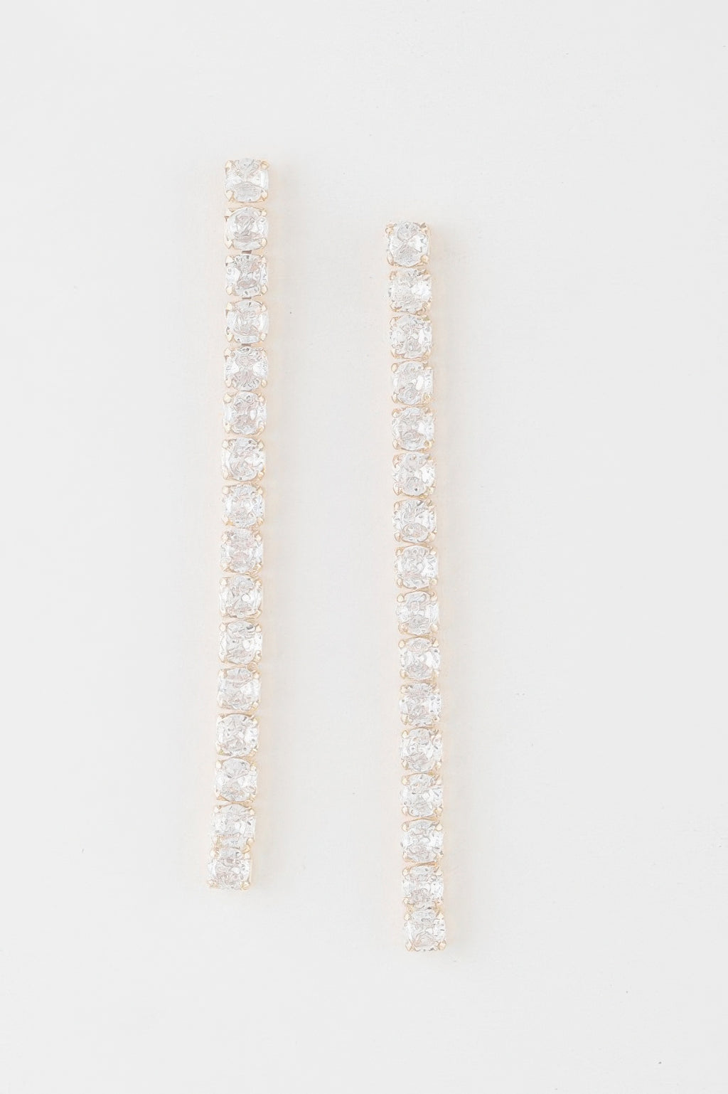 Gold-tone rhinestone bar drop earrings with clear stones, long vertical design