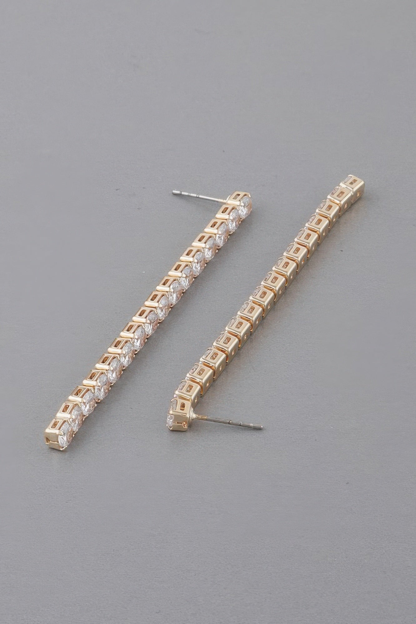 Gold-tone rhinestone bar drop earrings, row of square clear stones and posts