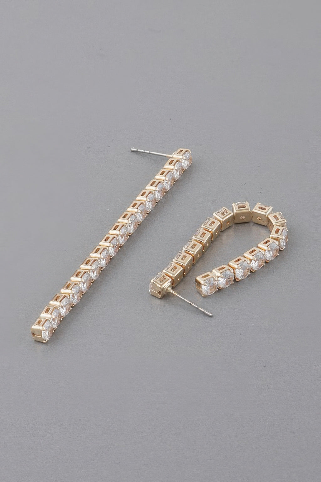 Gold-tone rhinestone bar drop earrings and matching rhinestone hoop, clear stones