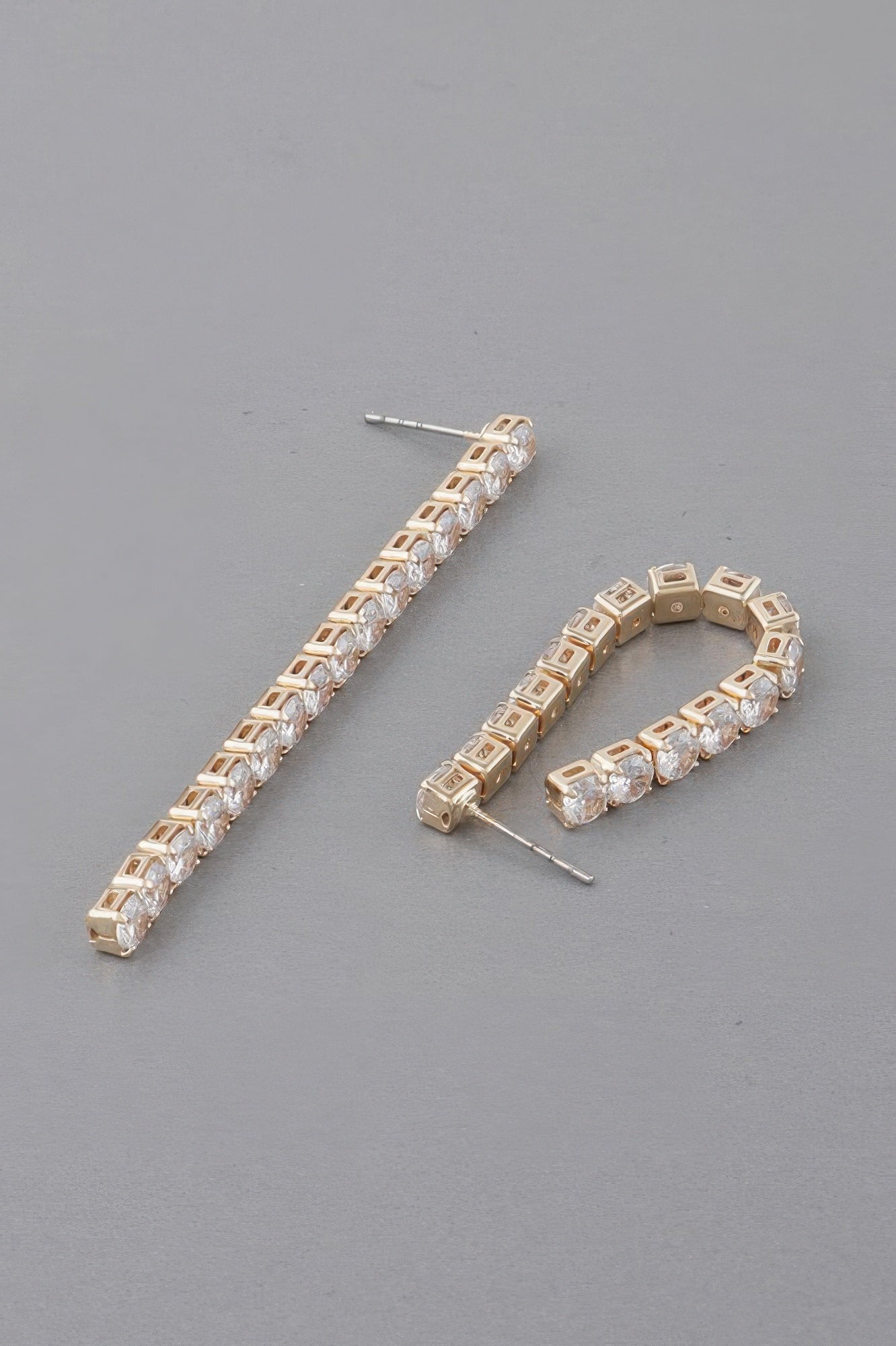 Gold-tone rhinestone bar drop earrings and matching rhinestone hoop, clear stones