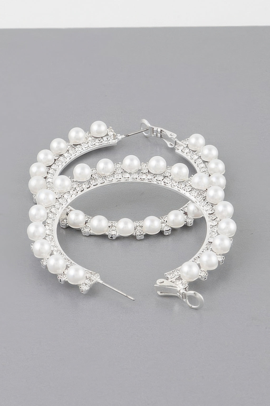 Pearl lined rhinestone hoop earrings, silver-tone with white pearl beads