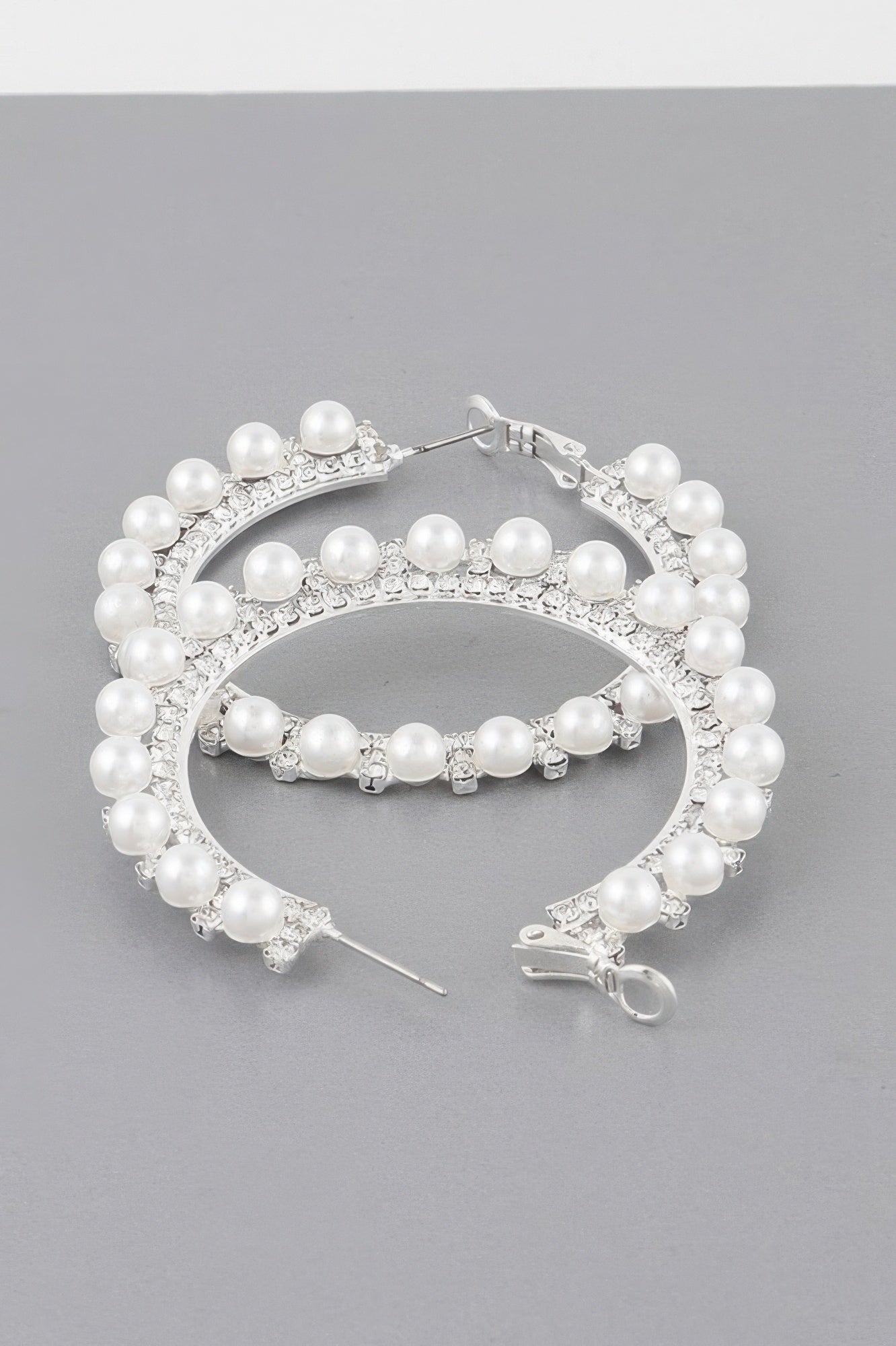 Pearl lined rhinestone hoop earrings, silver-tone with white pearl beads