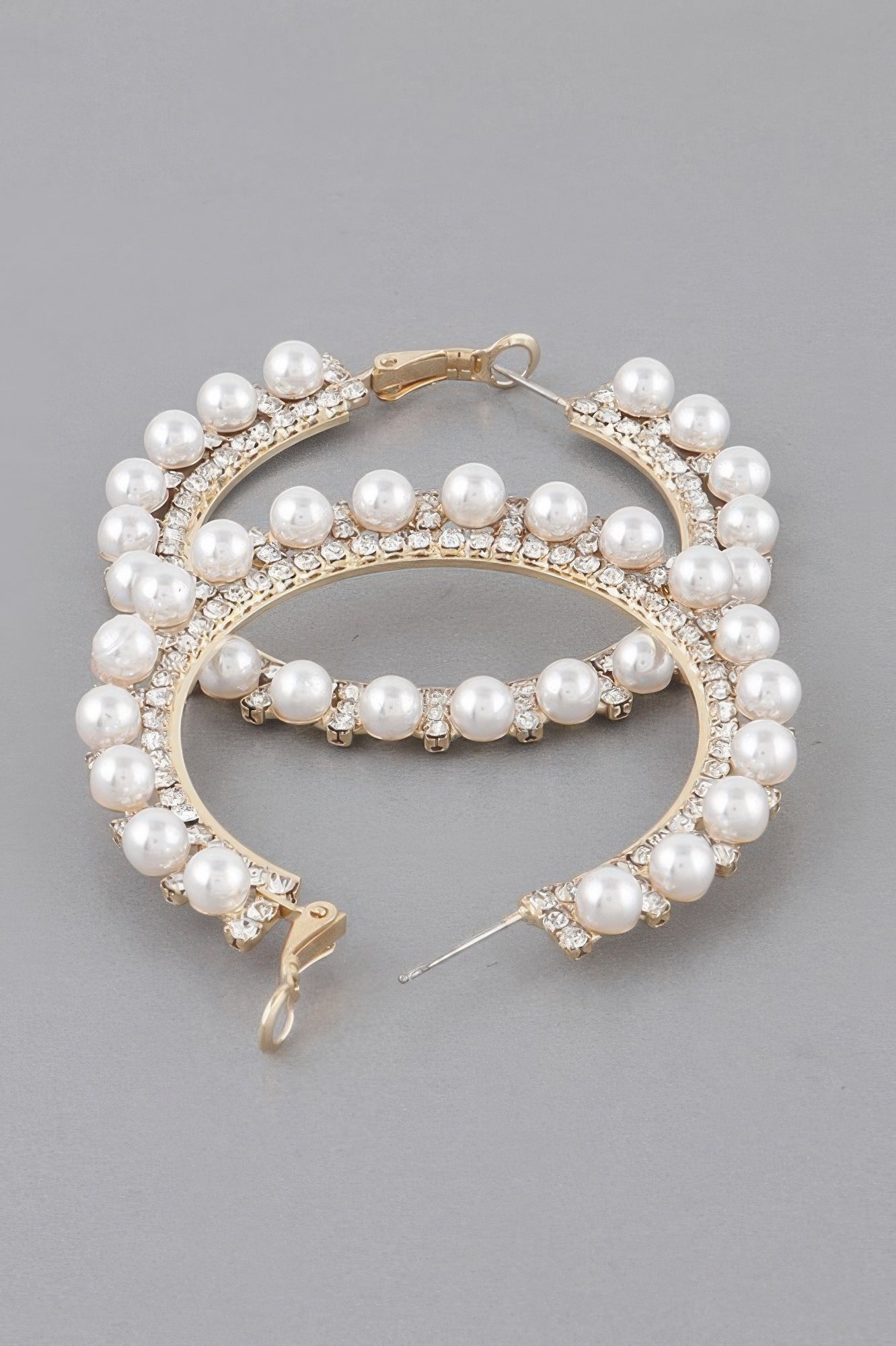 Gold pearl rhinestone hoop earrings with pavé stones and pearl bead fringe