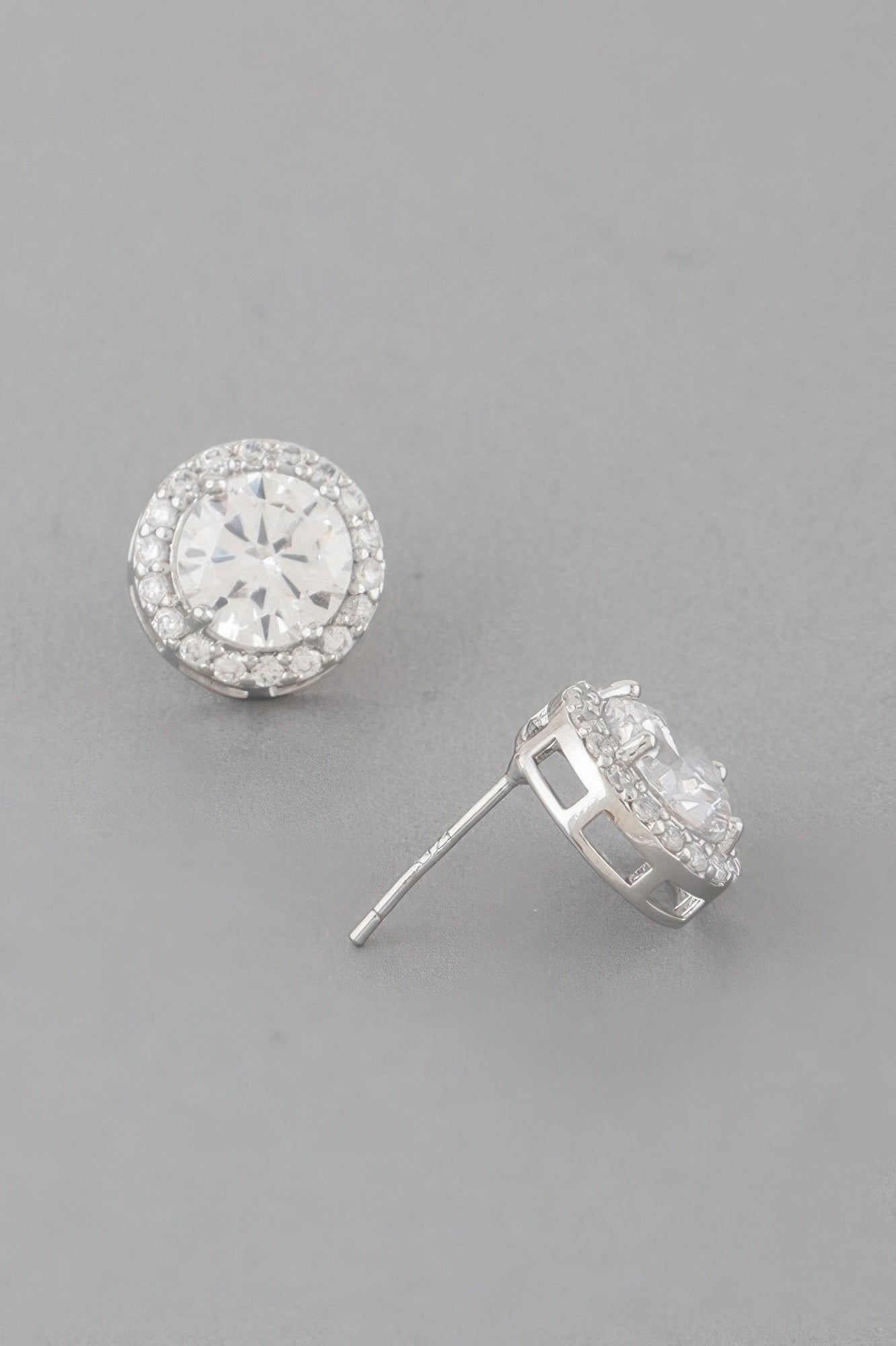 Silver round stud earrings, clear center stone with glittering halo