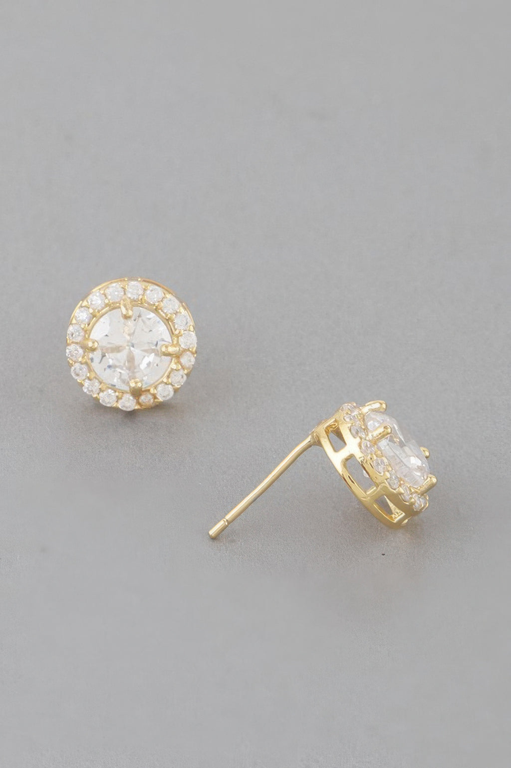 Gold round stud earring with clear halo stones; back post and clasp visible