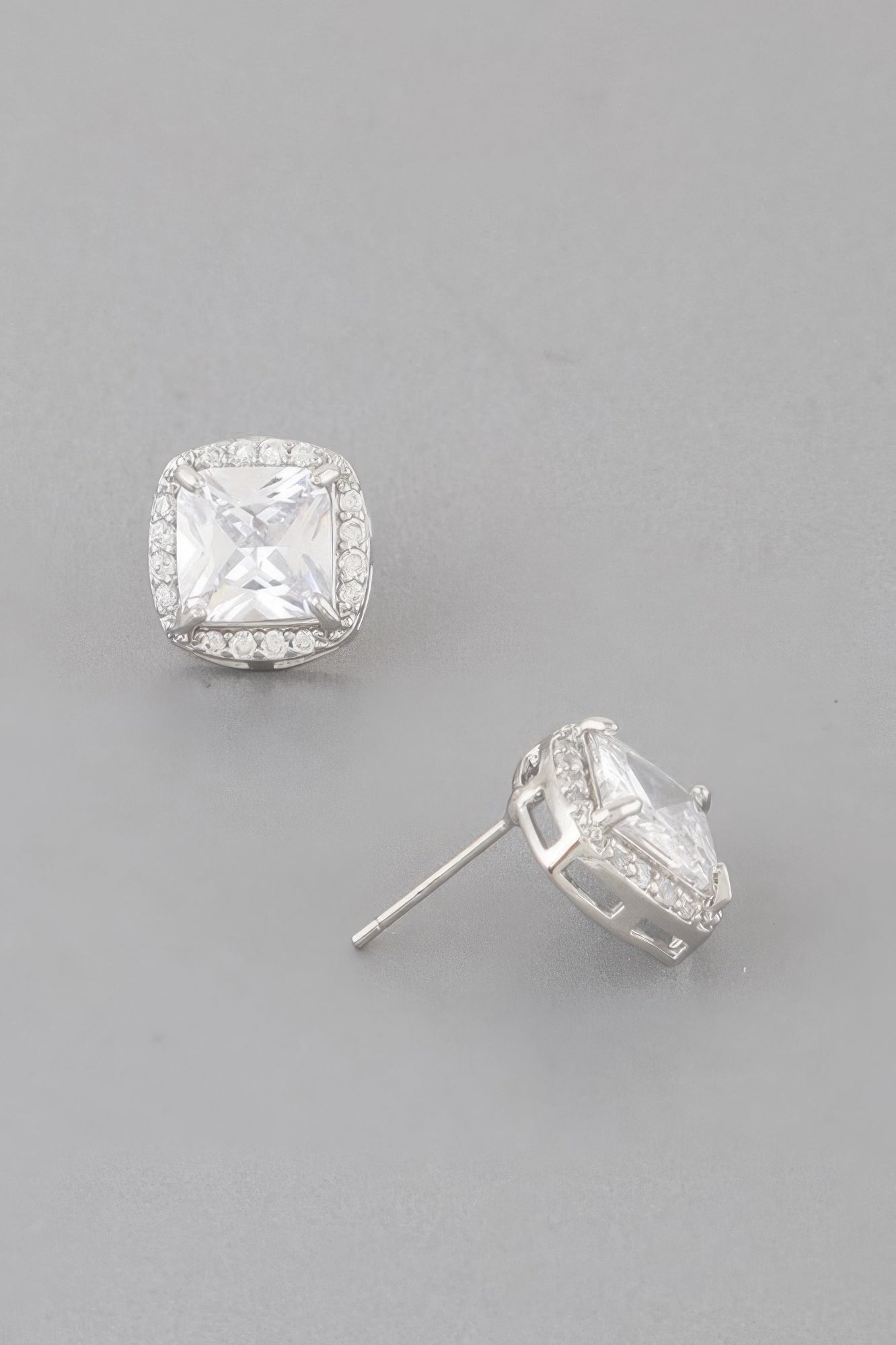 Silver-clear cubic rhinestone stud earrings with square cushion center and halo