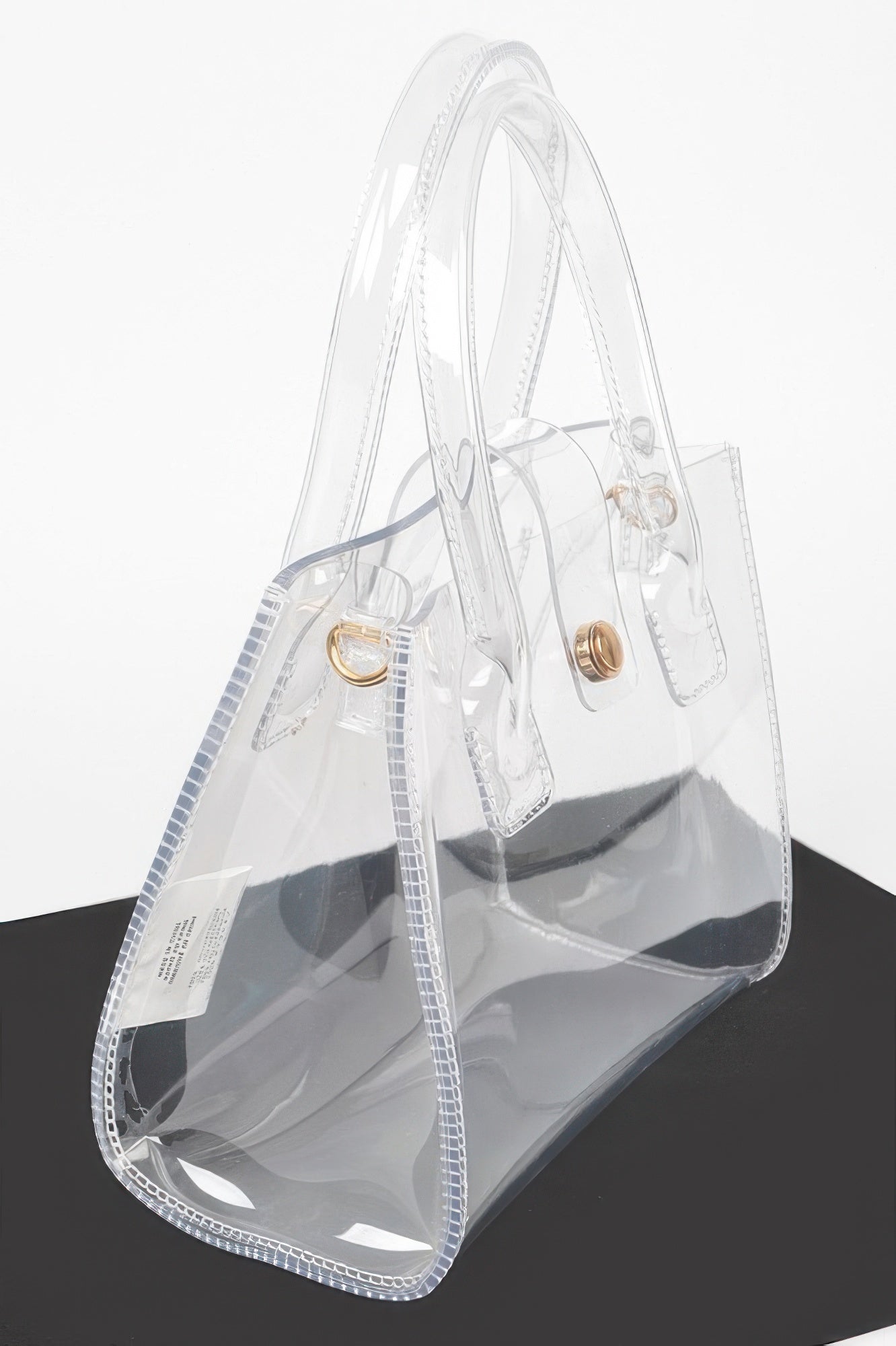 Transparent crossbody bag, clear with gold-tone hardware and adjustable shoulder strap