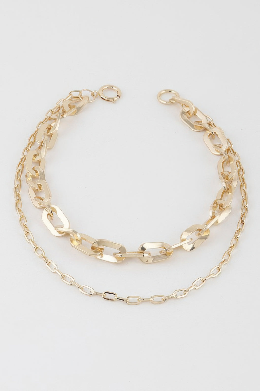 Gold double-link chain necklace with curb-style links and oval bar connectors