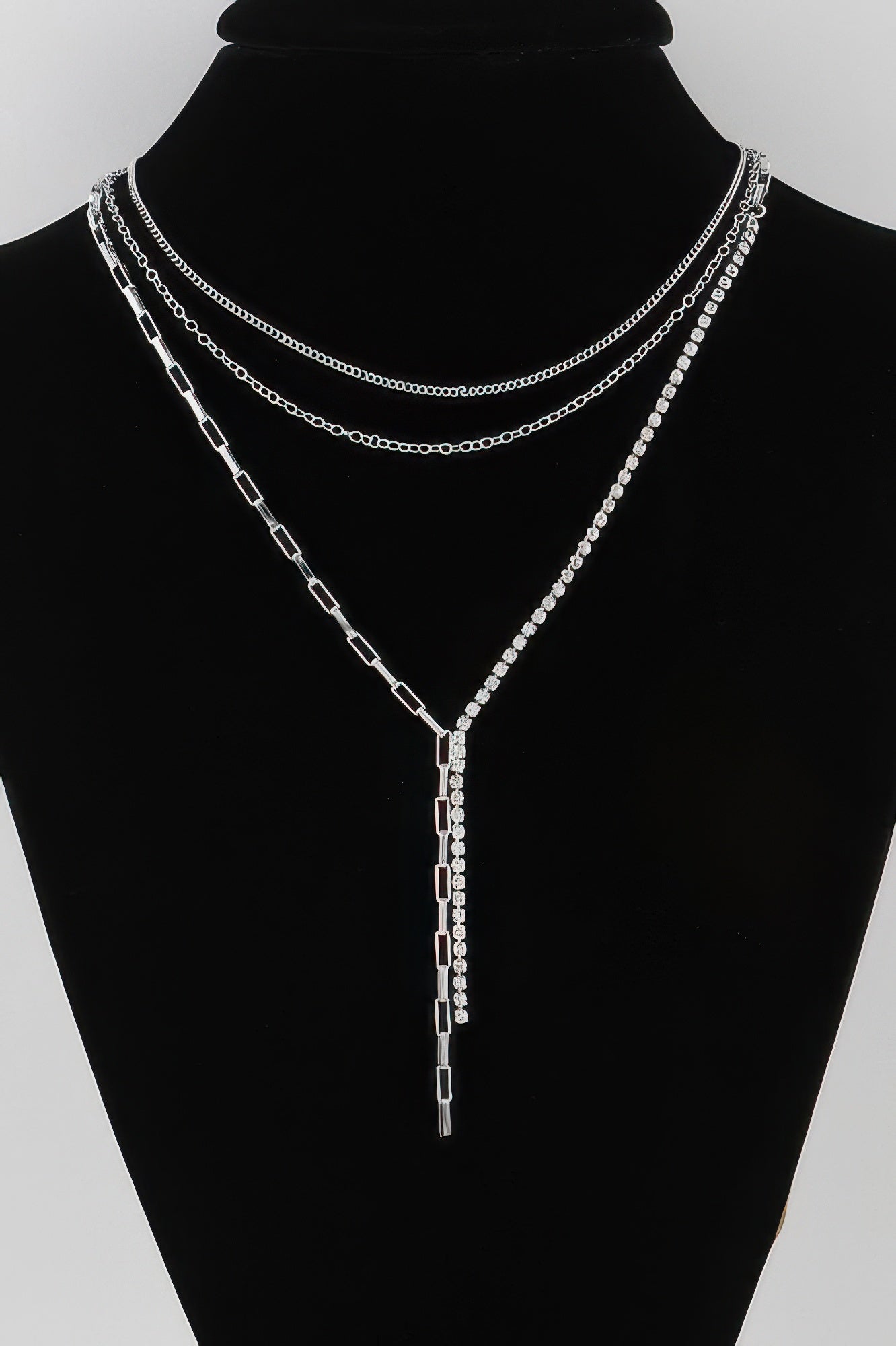 Multi-row rhinestone chain necklace with drop pendant on silver-tone links