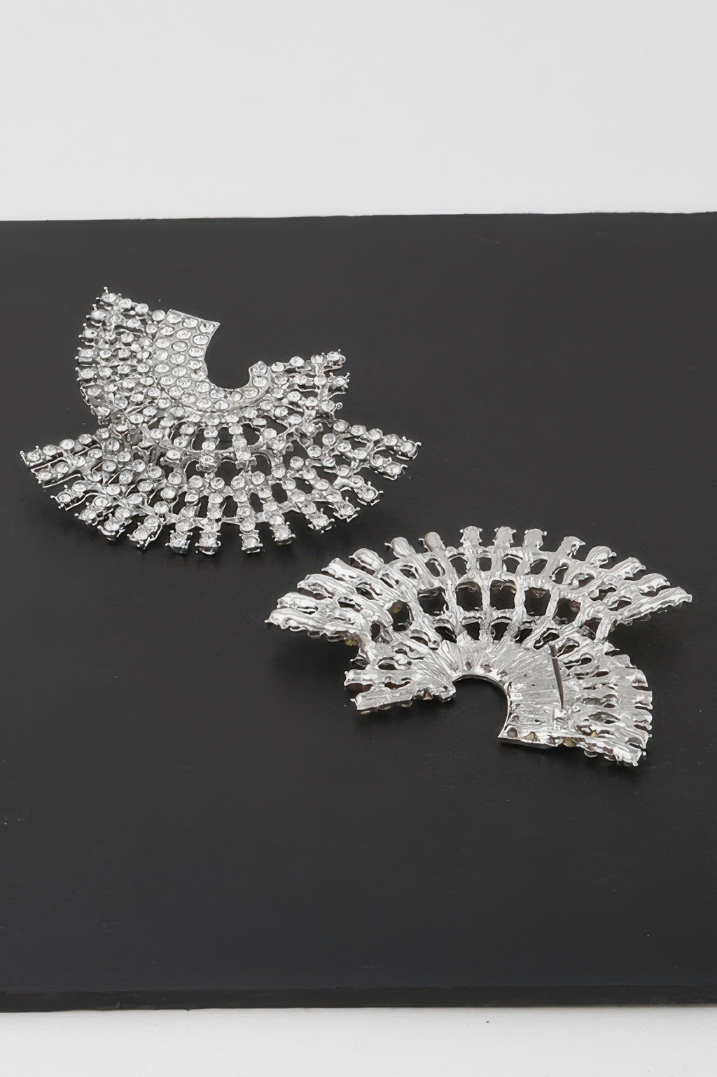 Silver rhinestone fan-style disk earrings with radiating stone bands