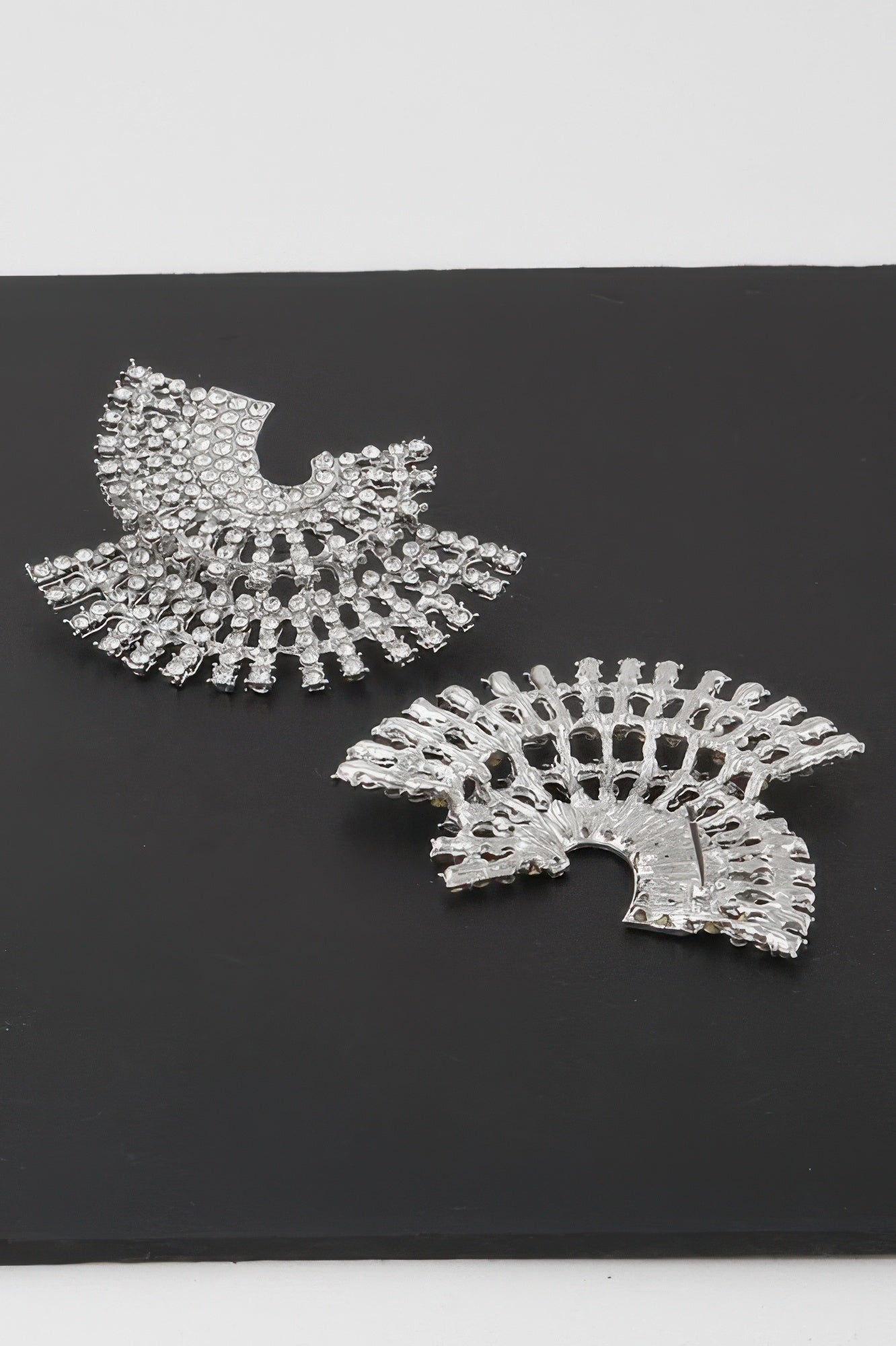 Silver rhinestone fan-style disk earrings with radiating stone bands