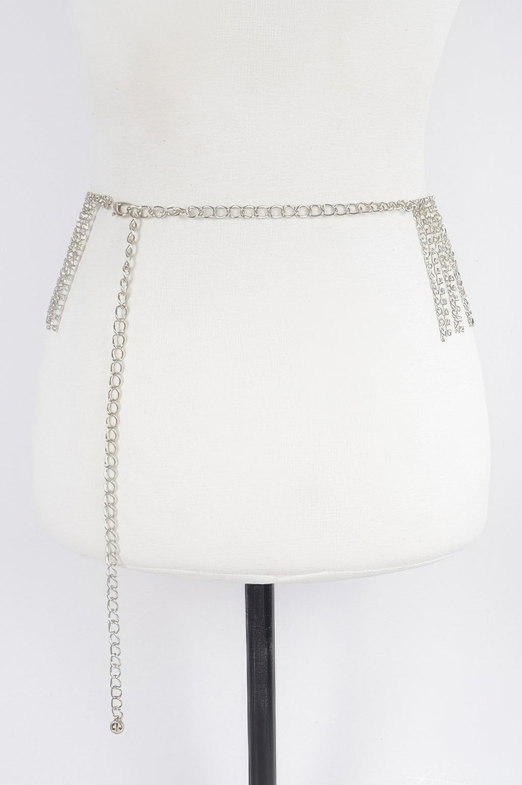 Silver rhinestone waist belt with chain ties hanging down, one size