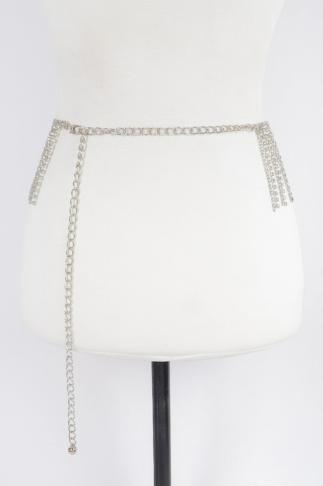 Silver rhinestone waist belt with chain ties hanging down, one size