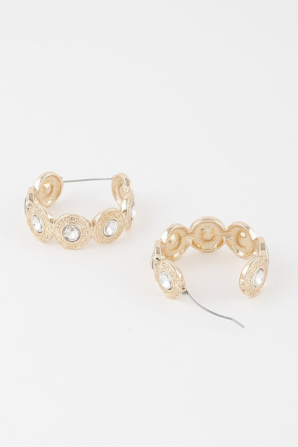 Greek key hoop earrings, gold with cream-tinted stones and small engraved medallions