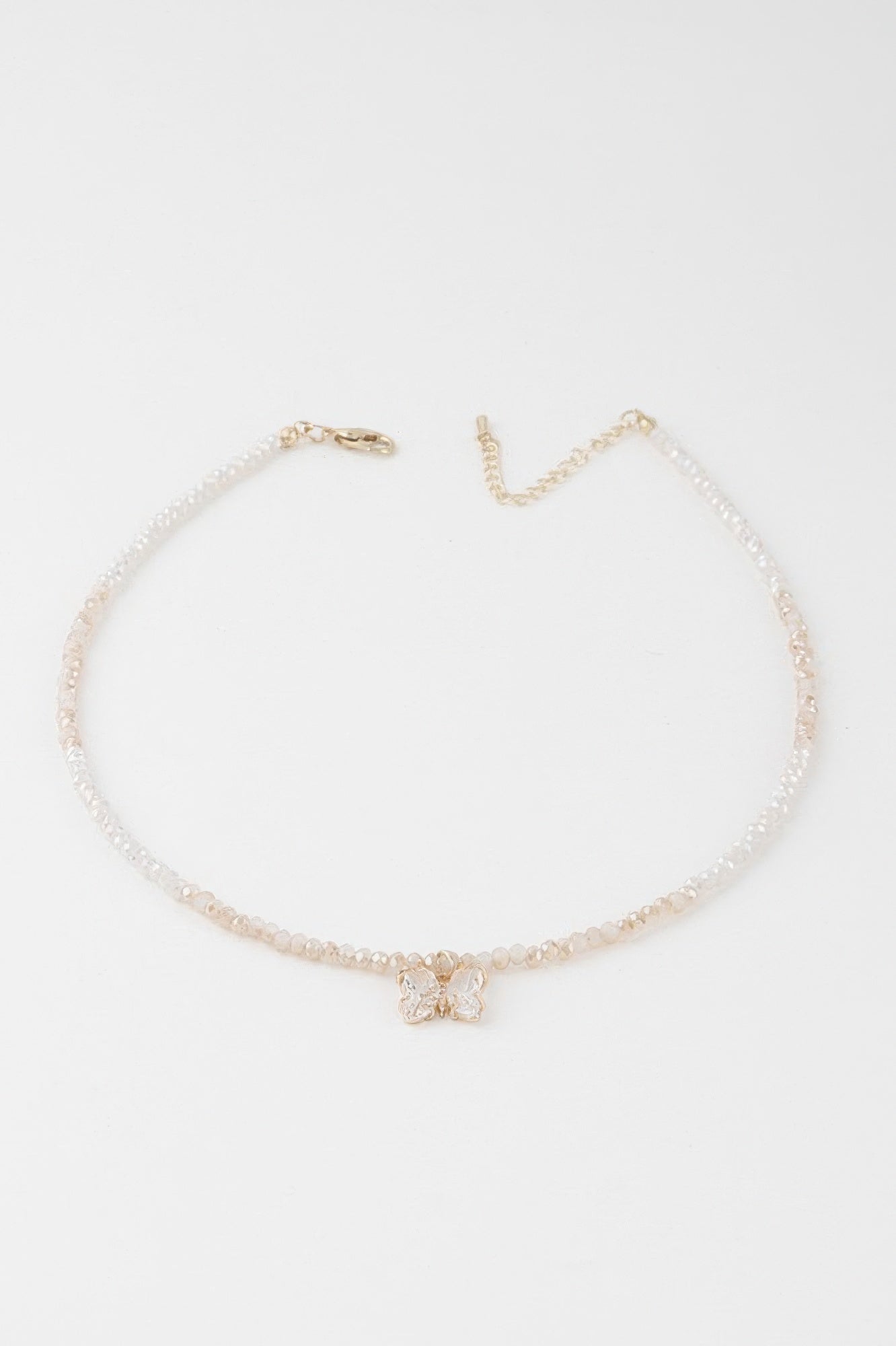 Crystal butterfly beaded necklace with pearl-like beads, gold clasp, white and gold