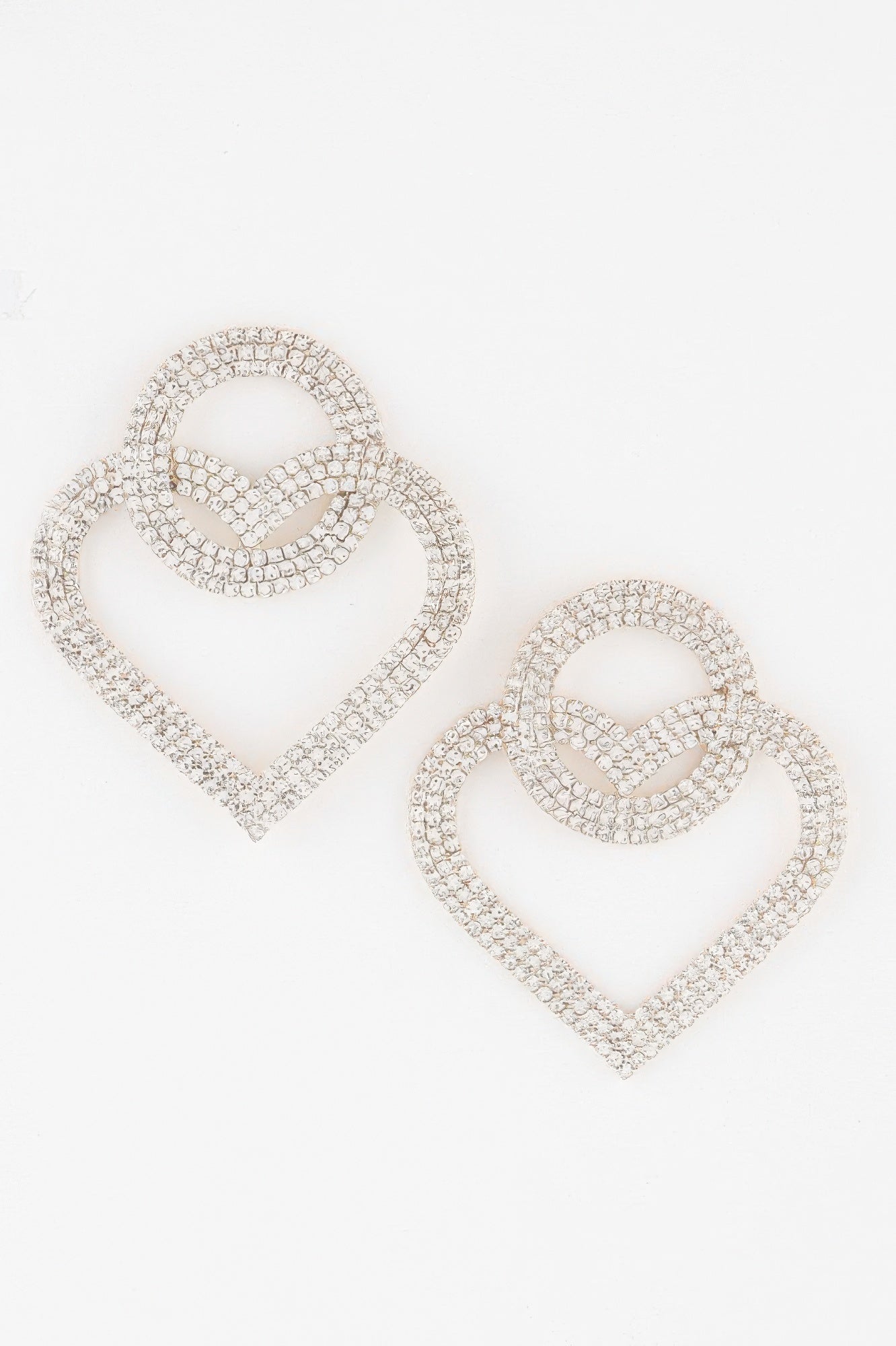 Interlaced heart earrings, gold-tone with clear stones and cross-caged center