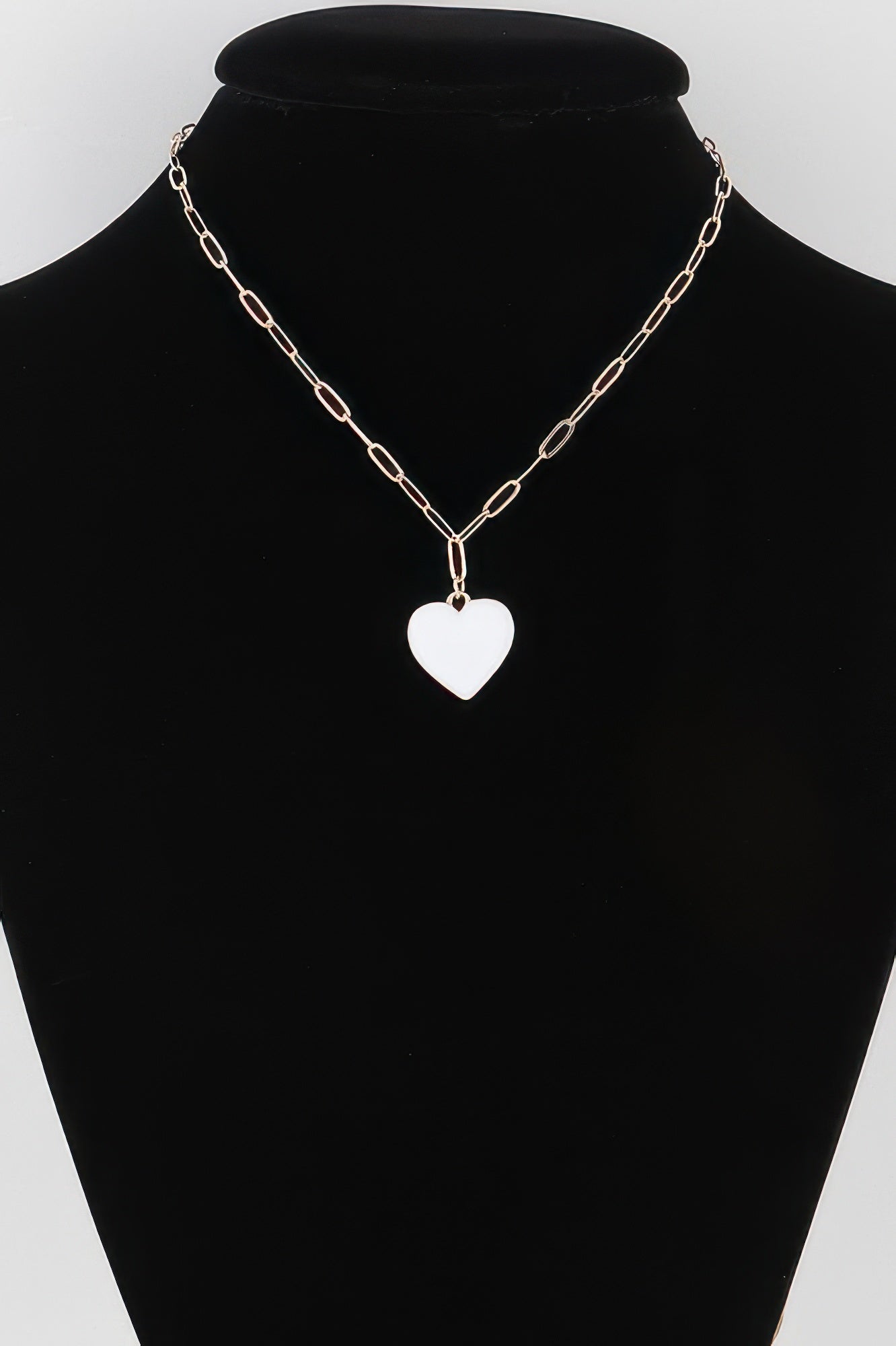Gold chain necklace with solid white heart pendant