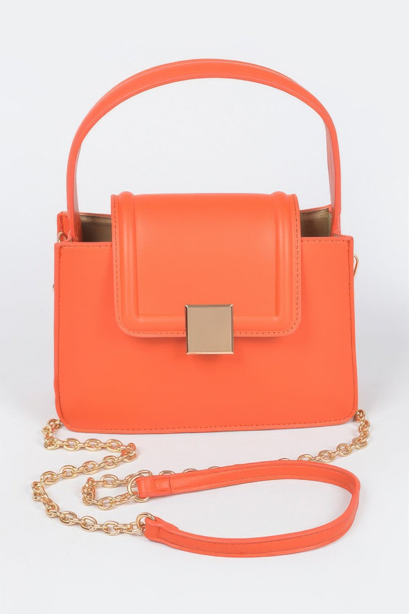Faux leather crossbody bag in orange with top handle, gold-tone chain, and front flap clasp