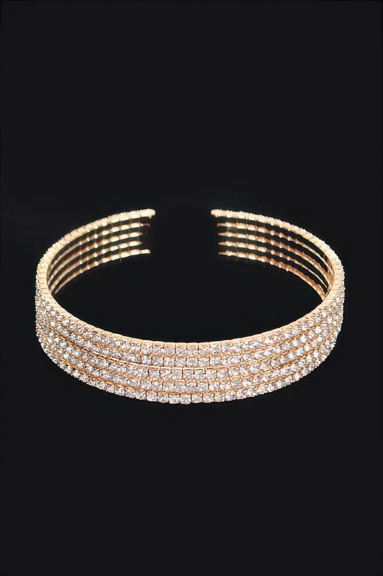 Gold-tone wrap rhinestone bangle, arched band with sparkly clear stones