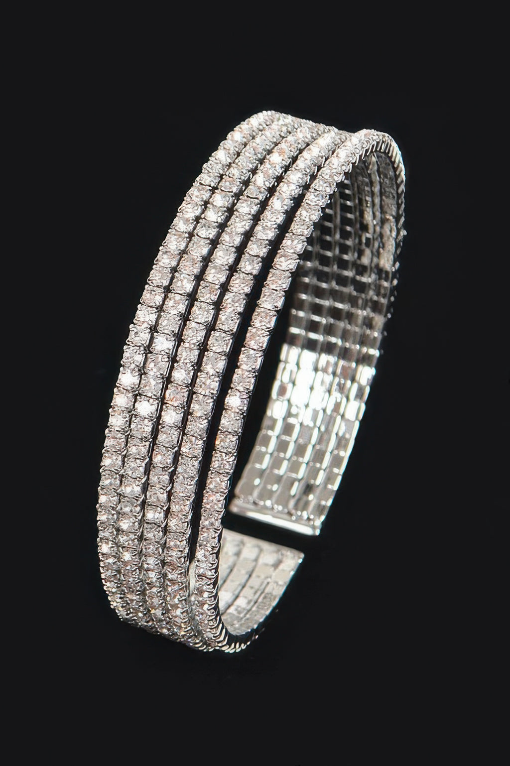 Silver-tone rhinestone wrap bangle, side view of stacked stone rows