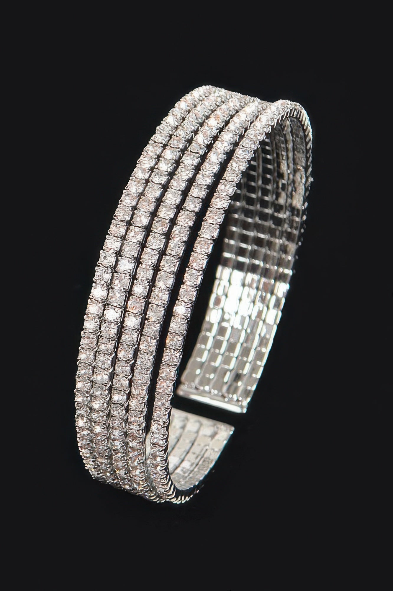 Silver-tone rhinestone wrap bangle, side view of stacked stone rows
