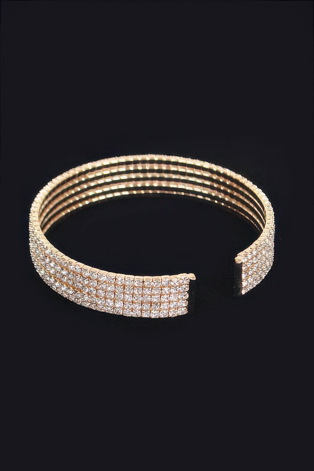 Gold-tone wrap rhinestone bangle with open clasp detail