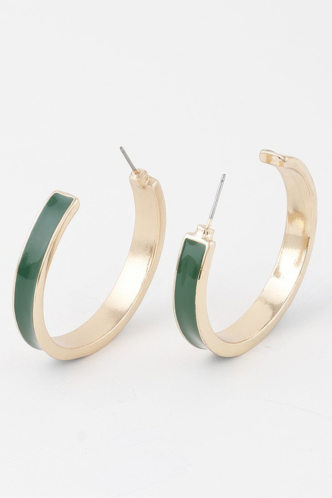 Solid lined hoop earrings in gold with green enamel