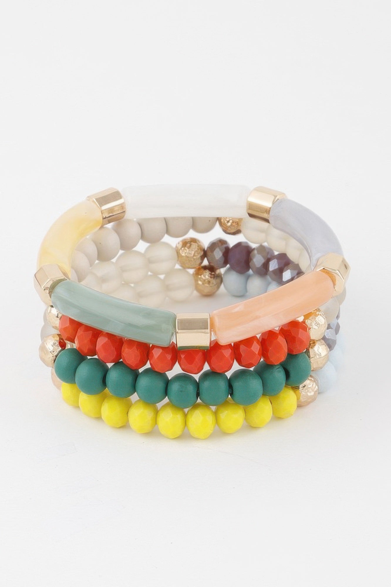Stacked multicolor beaded tube bracelet with white, teal, red, yellow, and gold accents