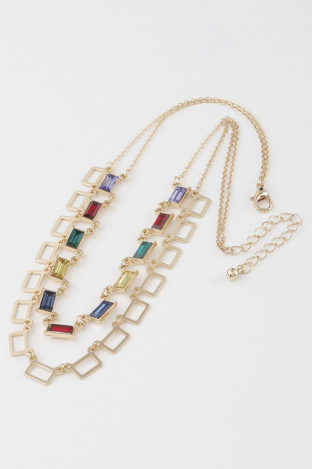 Gold-tone necklace with multicolor square crystal charms and small heart clasp