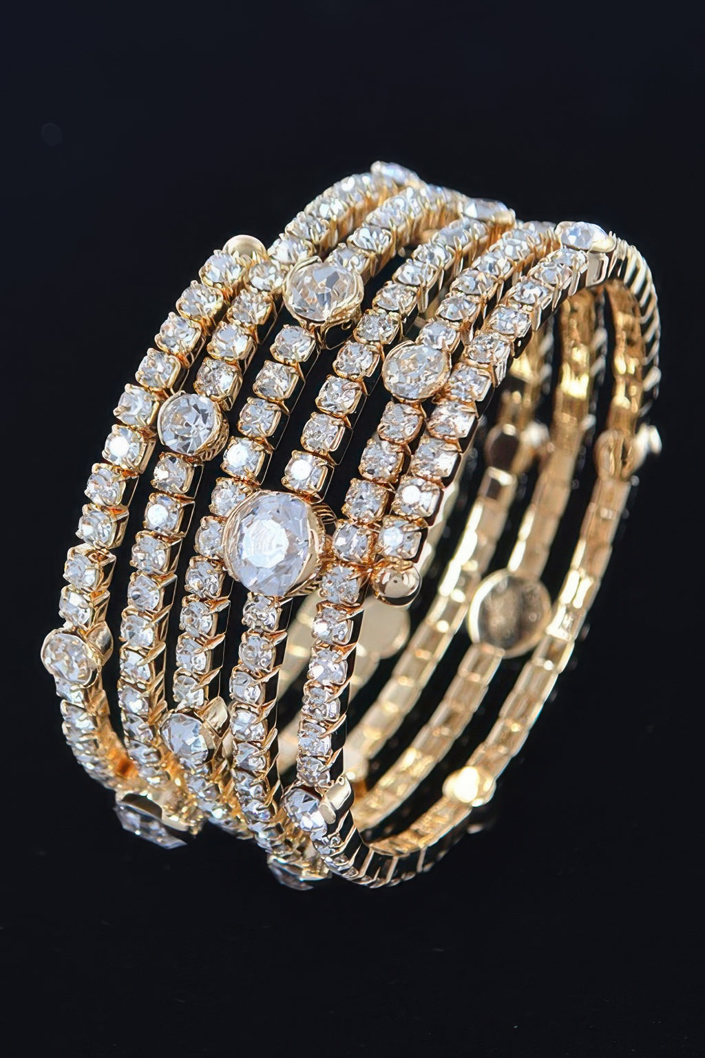 Gold rhinestone & crystal bracelet with wide multi-row oval stones and textured band