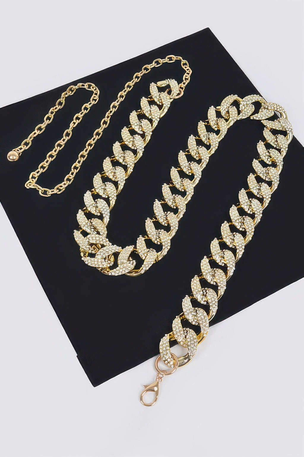 Gold-tone rhinestone chain belt with matching long chain and oval pavé links