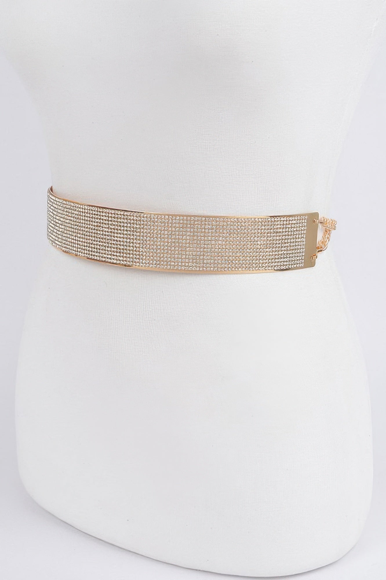 Gold rhinestone waist belt with side buckle closure on mannequin
