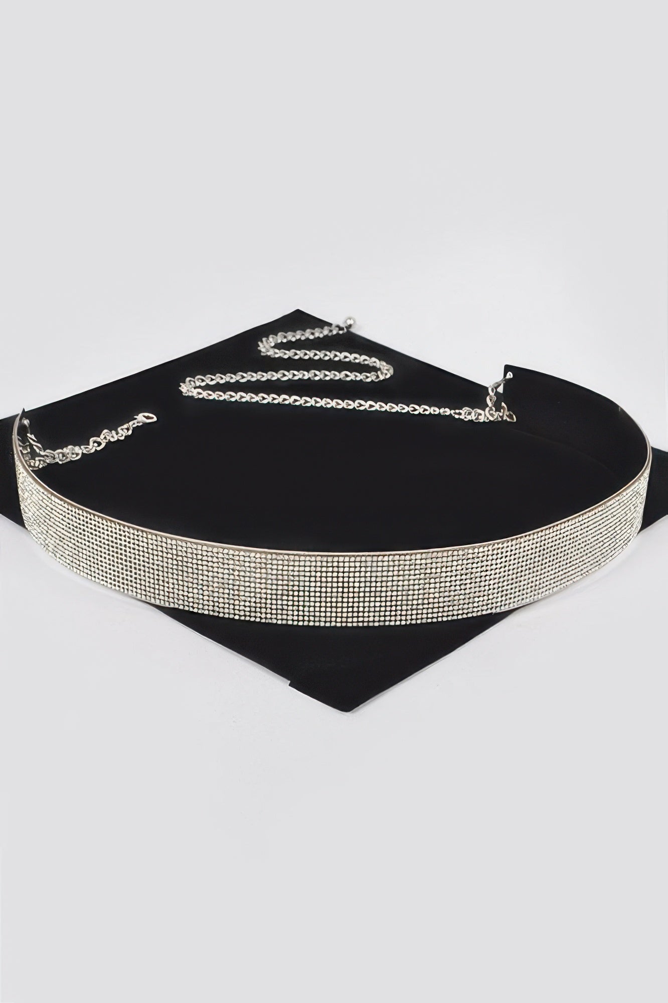 Gold rhinestone metal belt with chain links and clasp on black backing