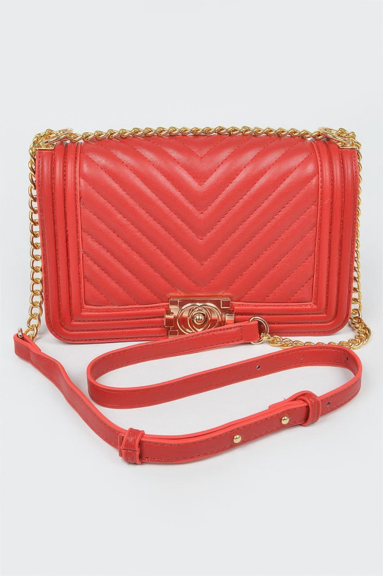 Red quilted chain shoulder bag with chevron stitching, top flap and gold-tone chain strap