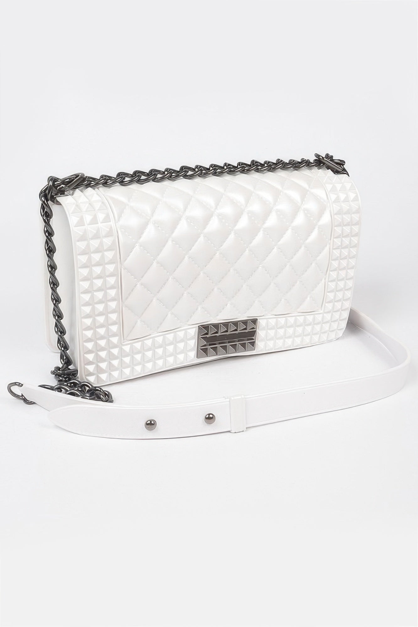 Quilted embossed jelly bag, white color, silver chain strap, flap with snap closure
