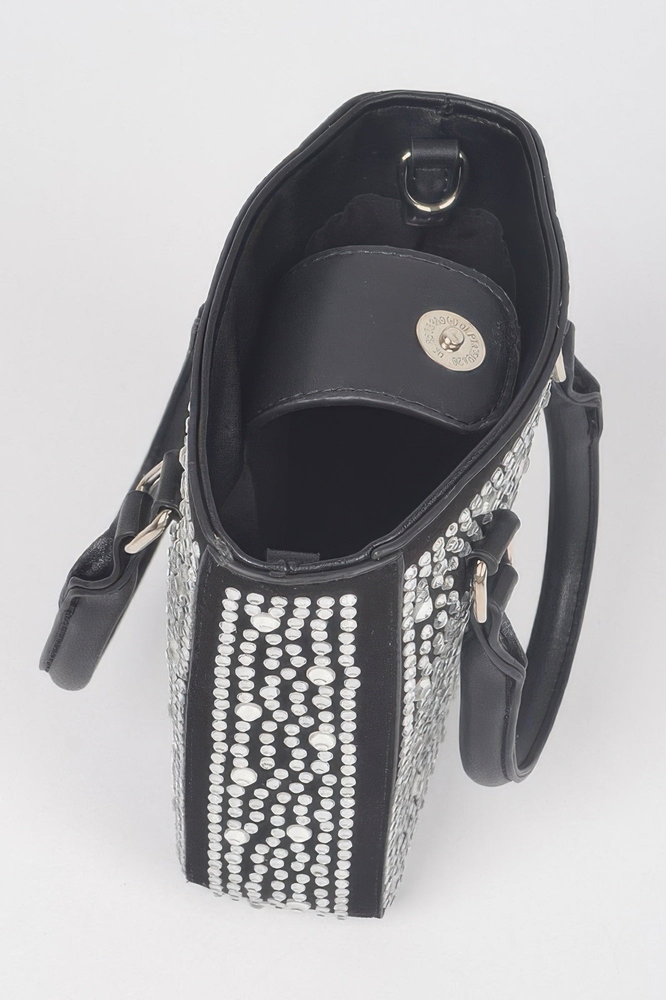 Inside view of Hotfix crossbody bag in black with open top and rhinestone trim