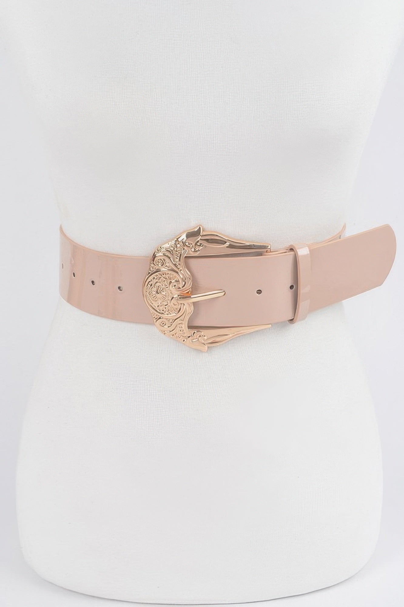 Shiny enamel belt in nude with ornate gold-tone metal buckle and adjustable holes