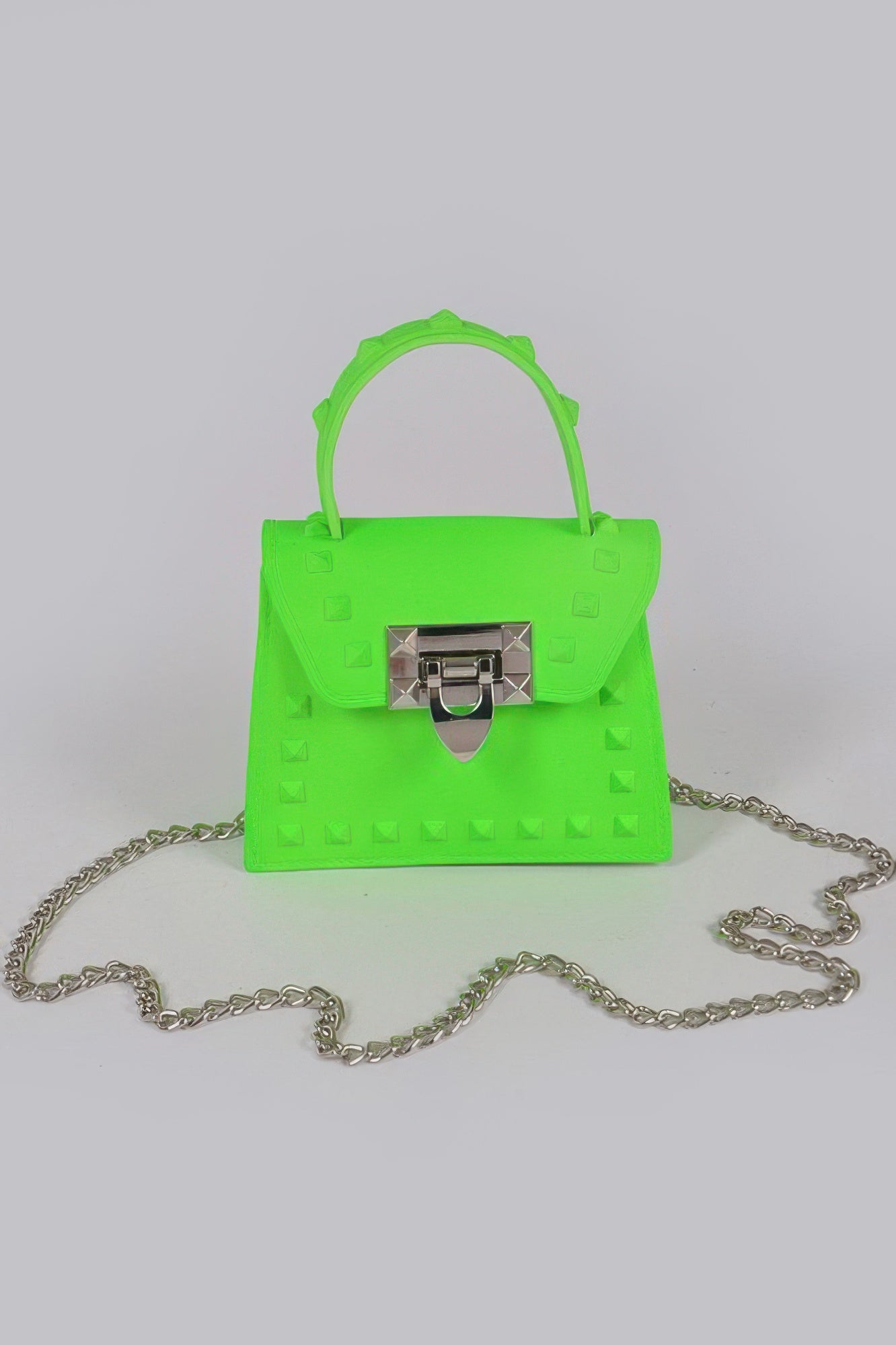 Jelly mini handbag in neon green with top handle, chain strap, studded front and clasp