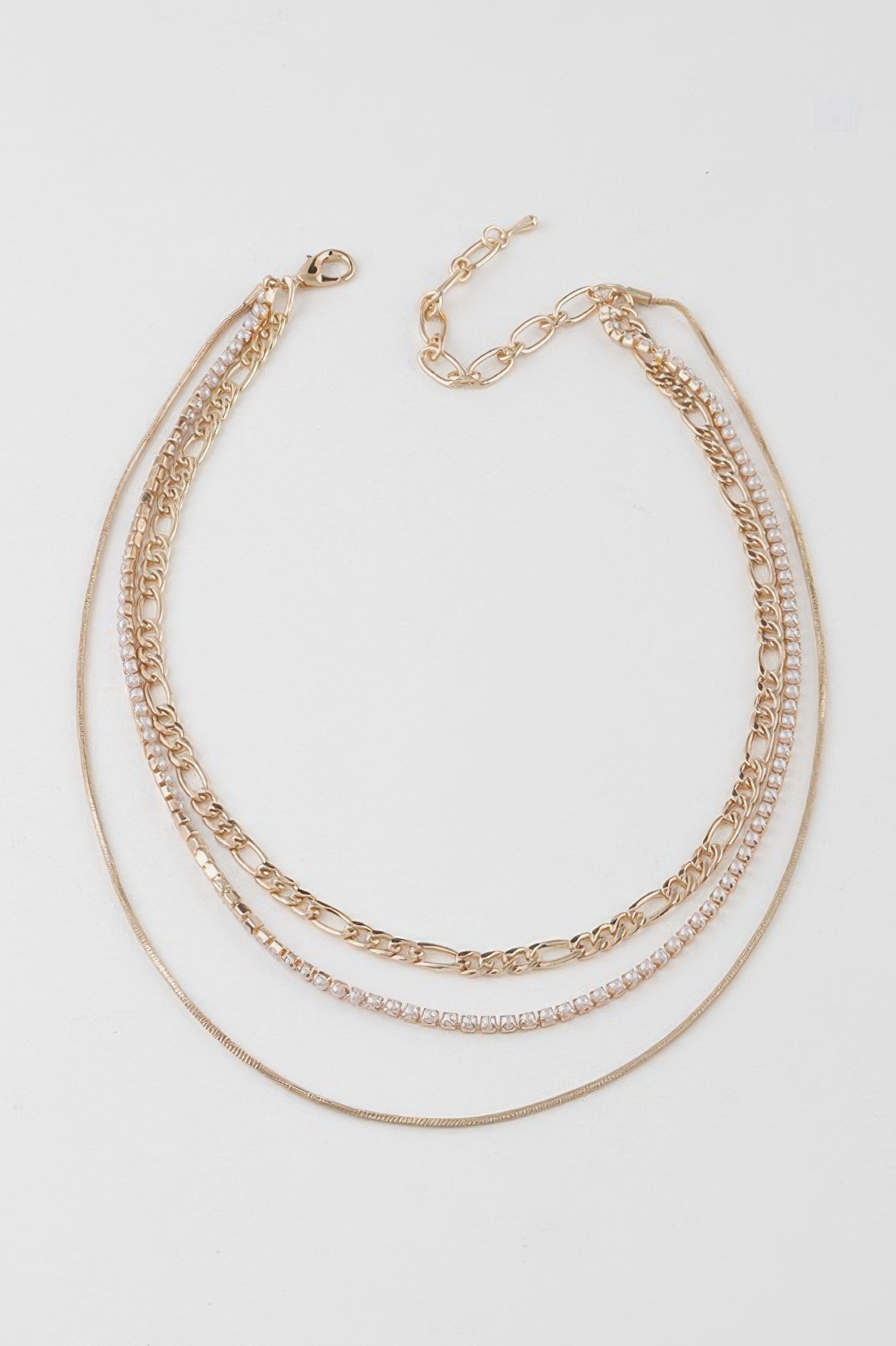 Gold and cream chain-bead necklace with multiple strands and lobster clasp
