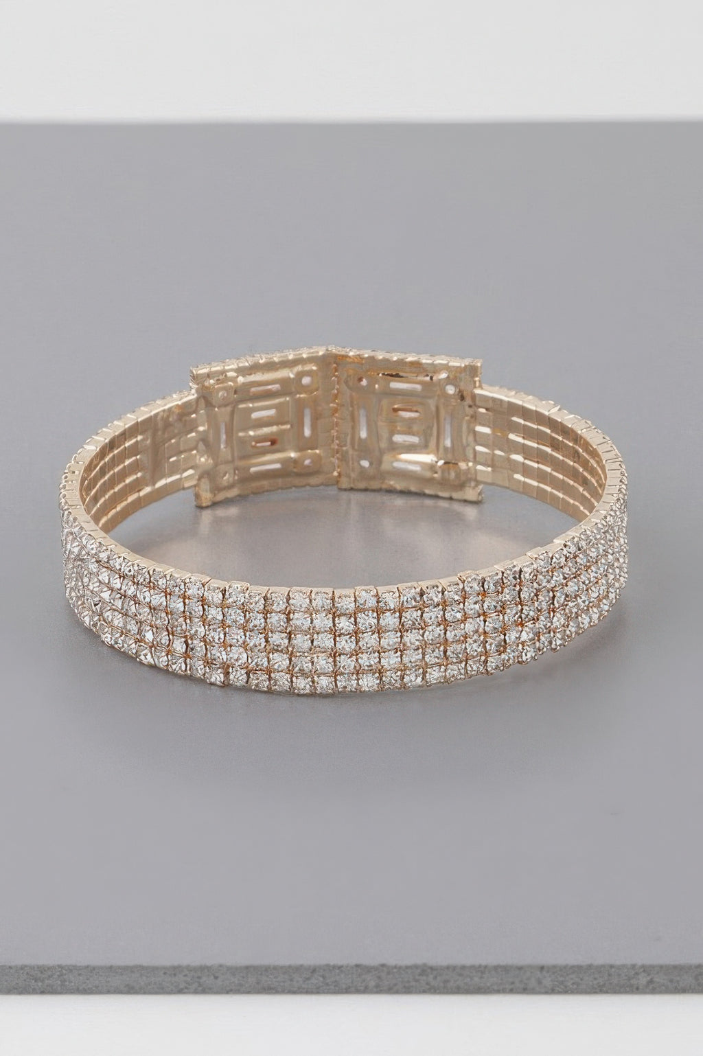 Gold-tone crystal block bracelet with sparkling grid links and clasp