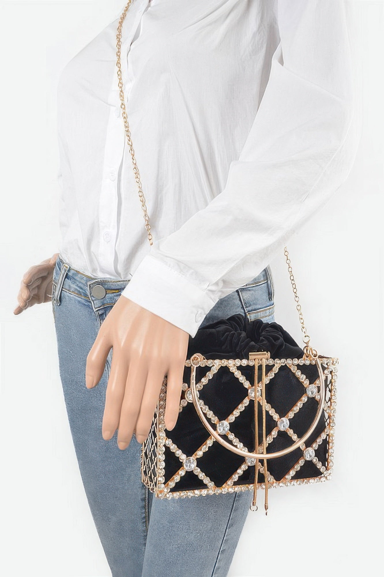 Black rhinestone metal frame clutch worn crossbody with gold chain strap