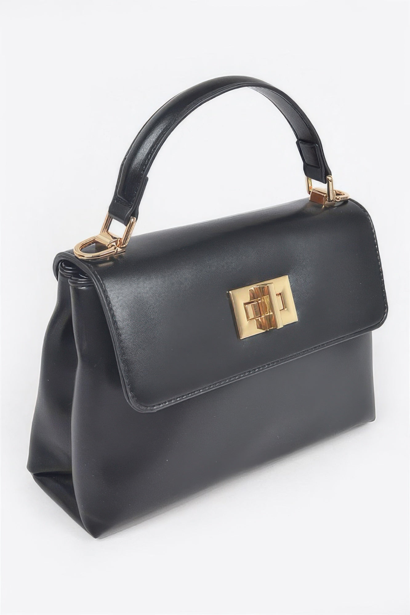 Black faux leather flap bag with gold front clasp and structured top handle