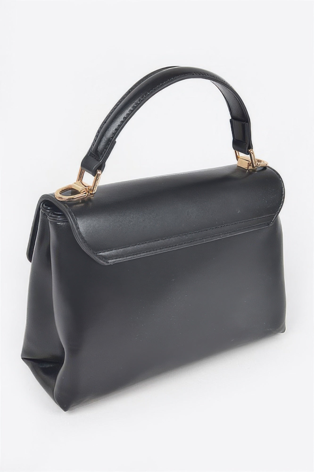 Black faux leather flap bag with curved top handle and smooth side profile