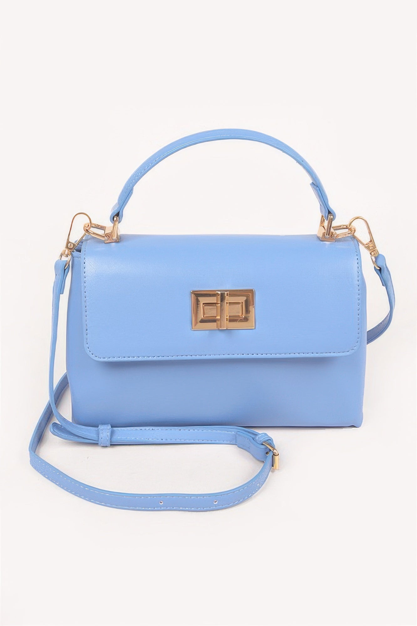 Blue faux leather flap bag with gold square clasp, top handle and crossbody strap