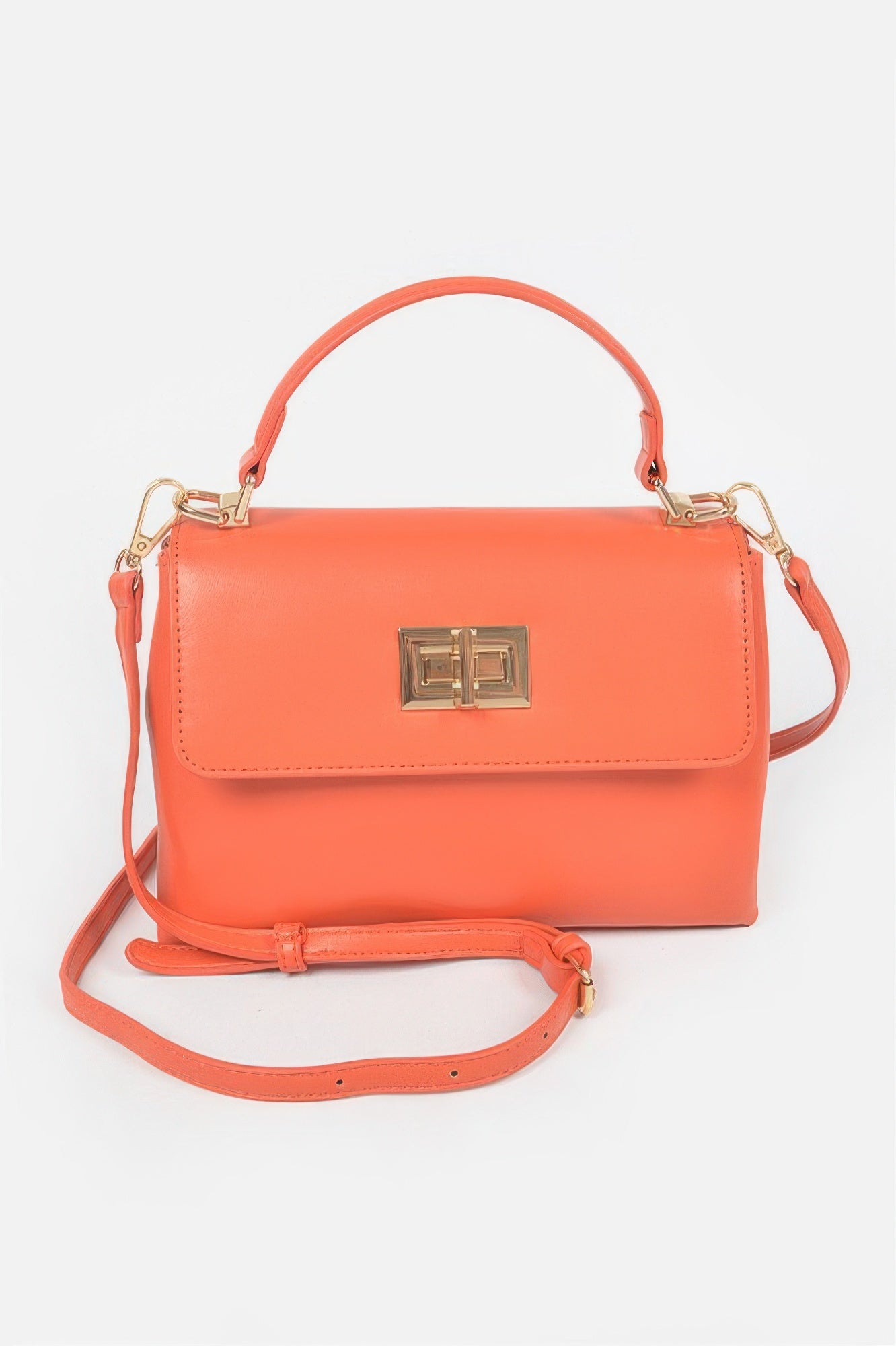 Orange faux leather flap bag with gold square clasp and crossbody shoulder strap