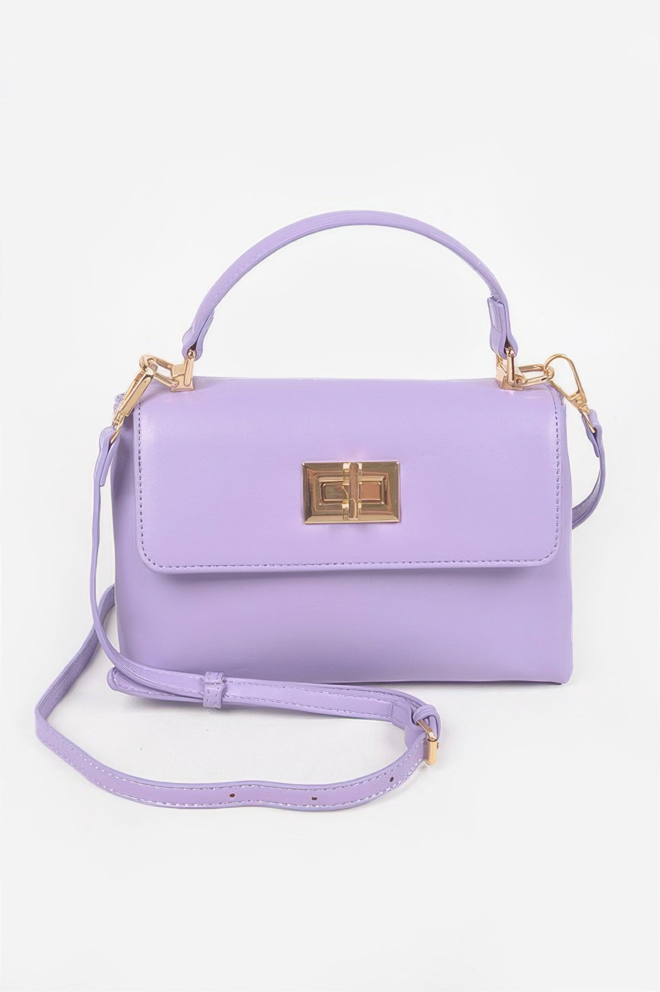 Purple faux leather flap bag with gold square clasp and shoulder strap