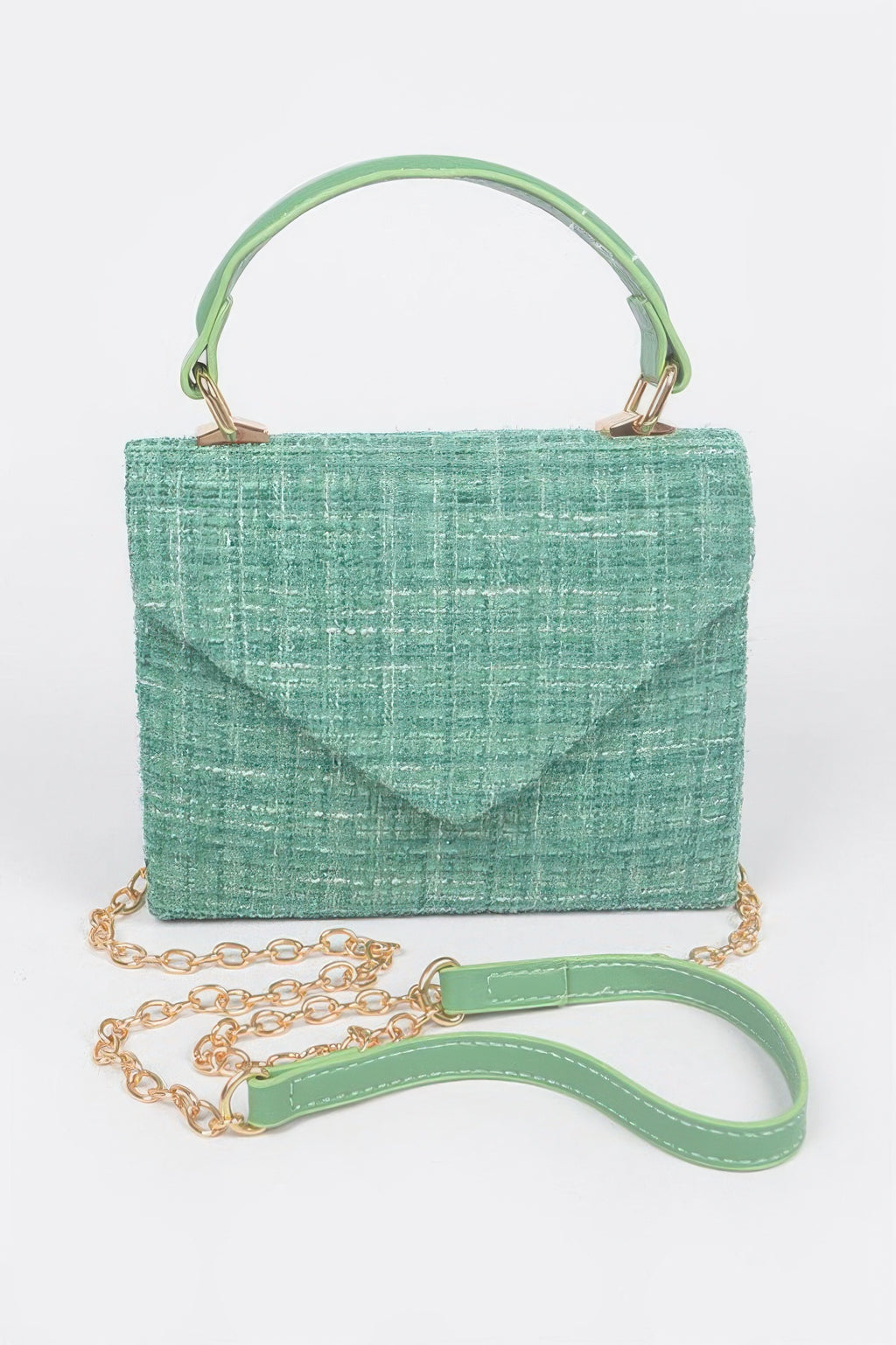 Tweed top handle bag in green with short handle, gold chain strap, and flap closure